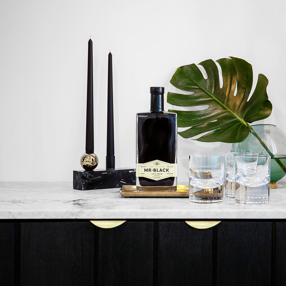  Kitchen Bathroom Hub_Brass Lip Pull on black cabinetry with marble top_ Bar area 